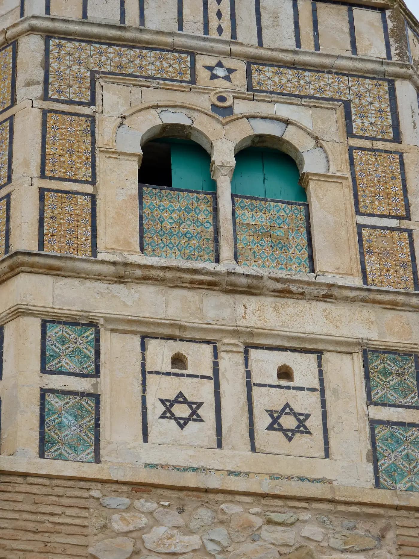 Andalusian tilework on the minaret of the Great Mosque of Testour, with Stars of David set among the tiles